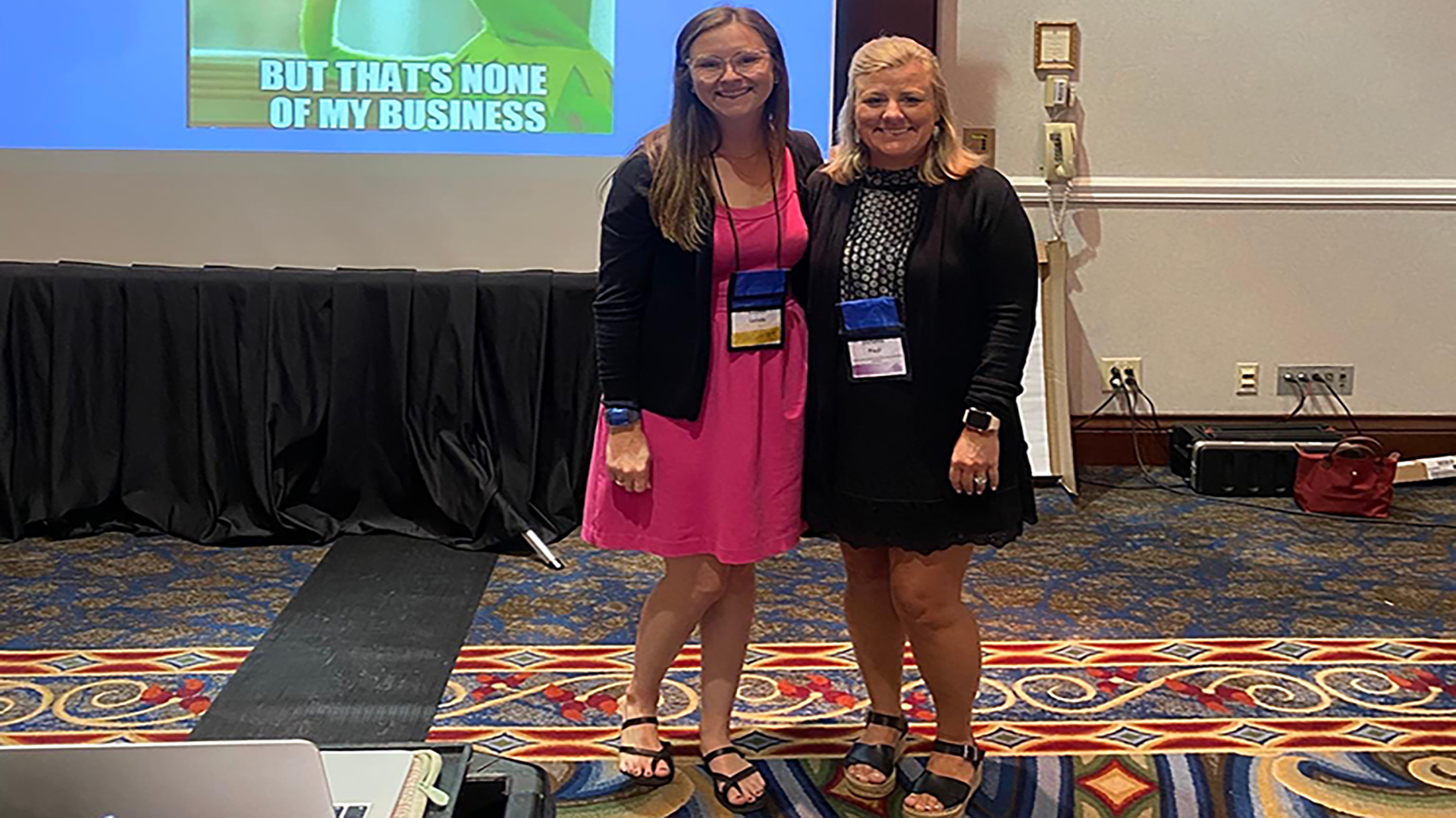 Lauren and Stefanie standing together at conference