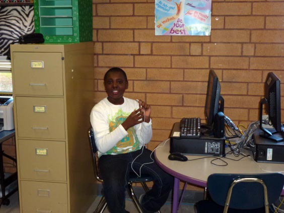 boy at a computer in a classroom
