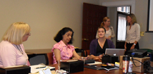 Trainees at a conference table