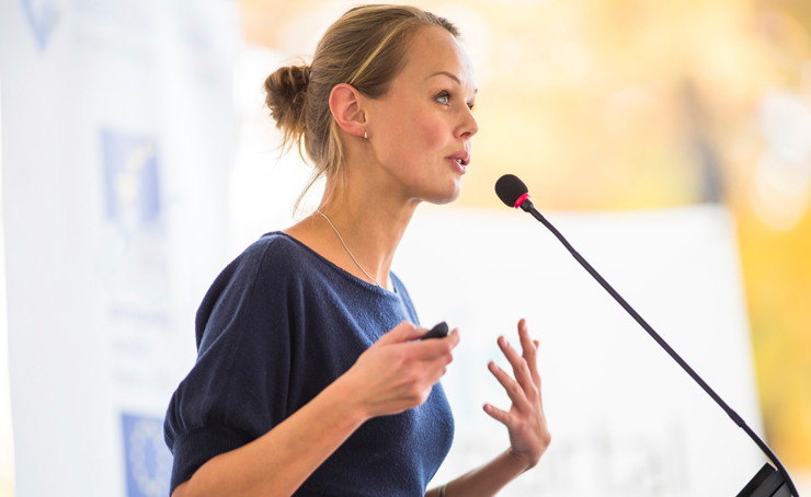 Woman speaking at a podium