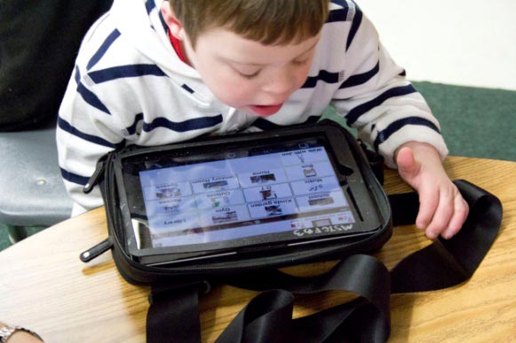 young male student using a tablet computer